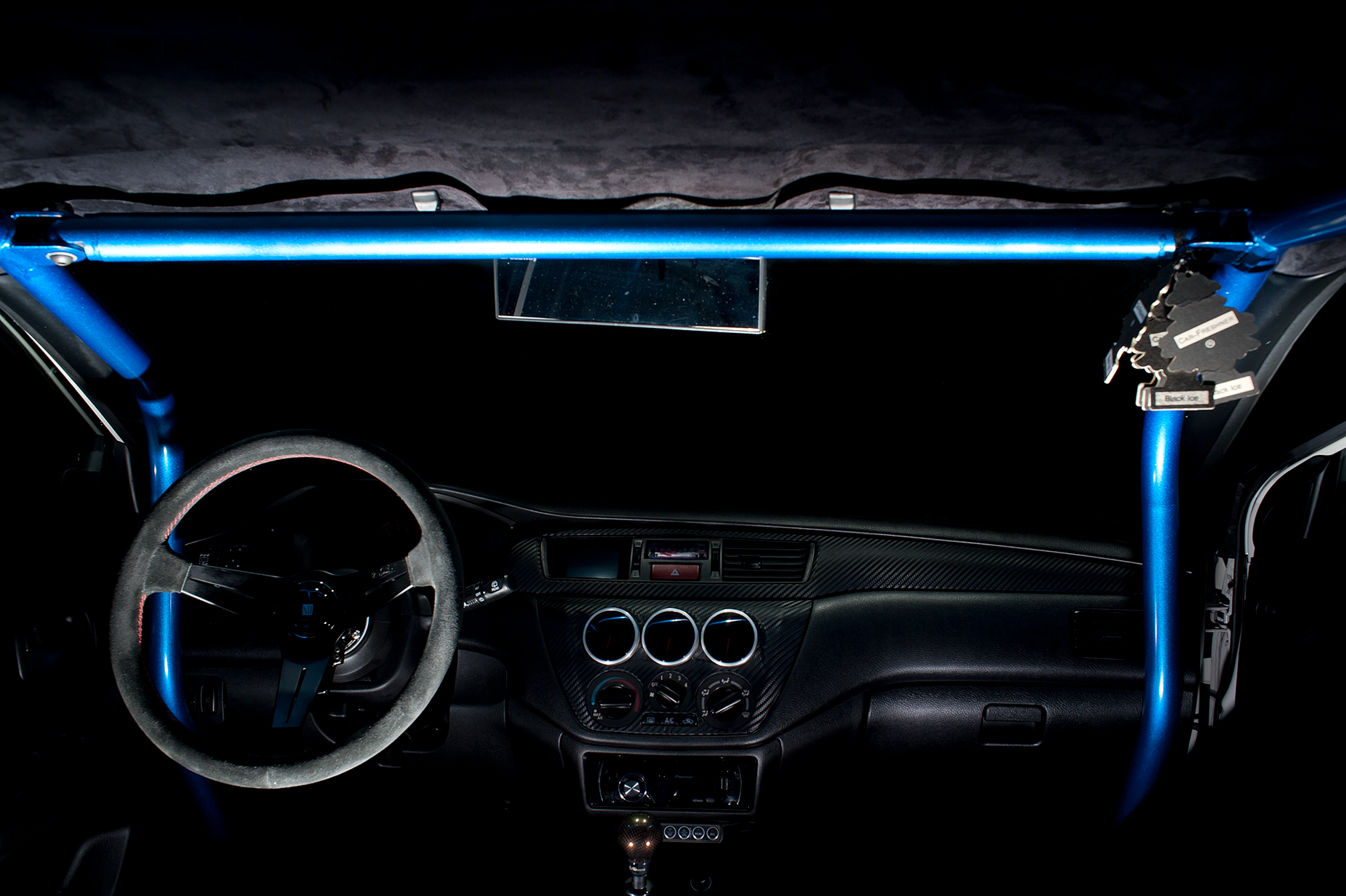 Interior shot of White Mitsubishi Evo IX with Varis body kit