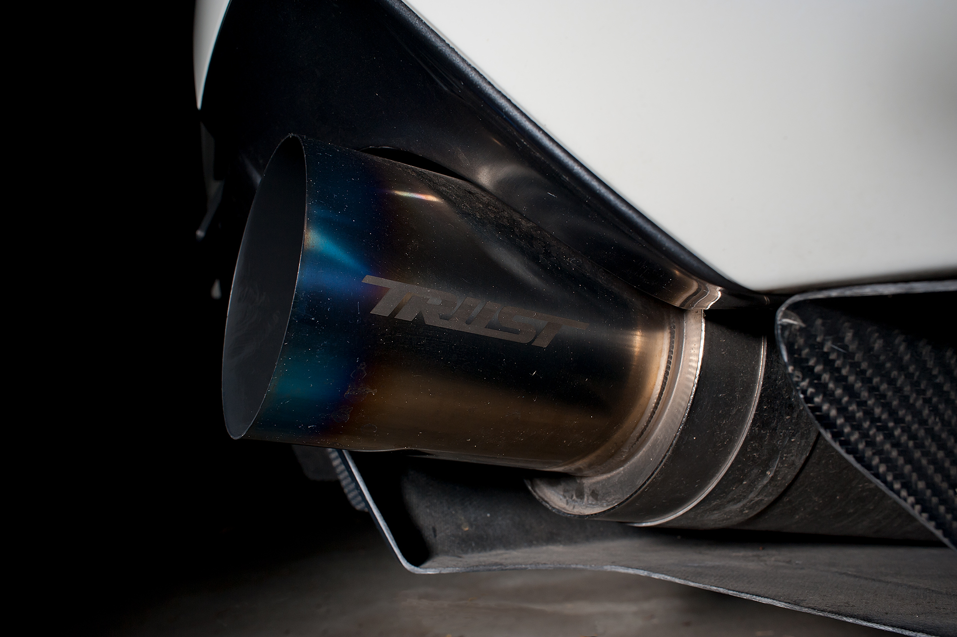 Exhaust shot of White Mitsubishi Evo IX with Varis body kit