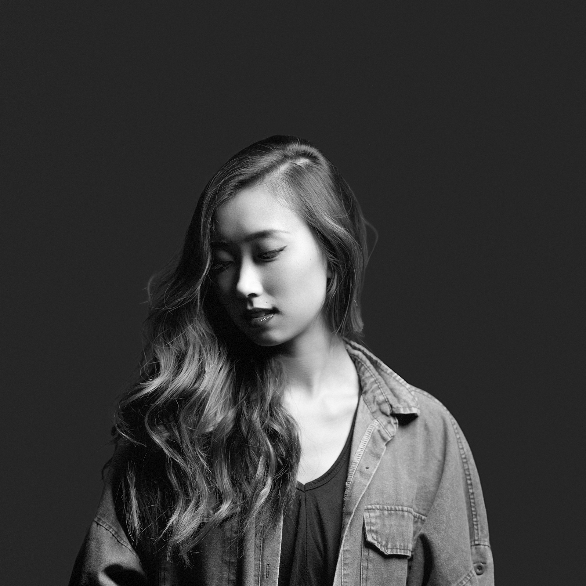 Black & white 1/2 body studio portrait of Korean American model Shawna Kim