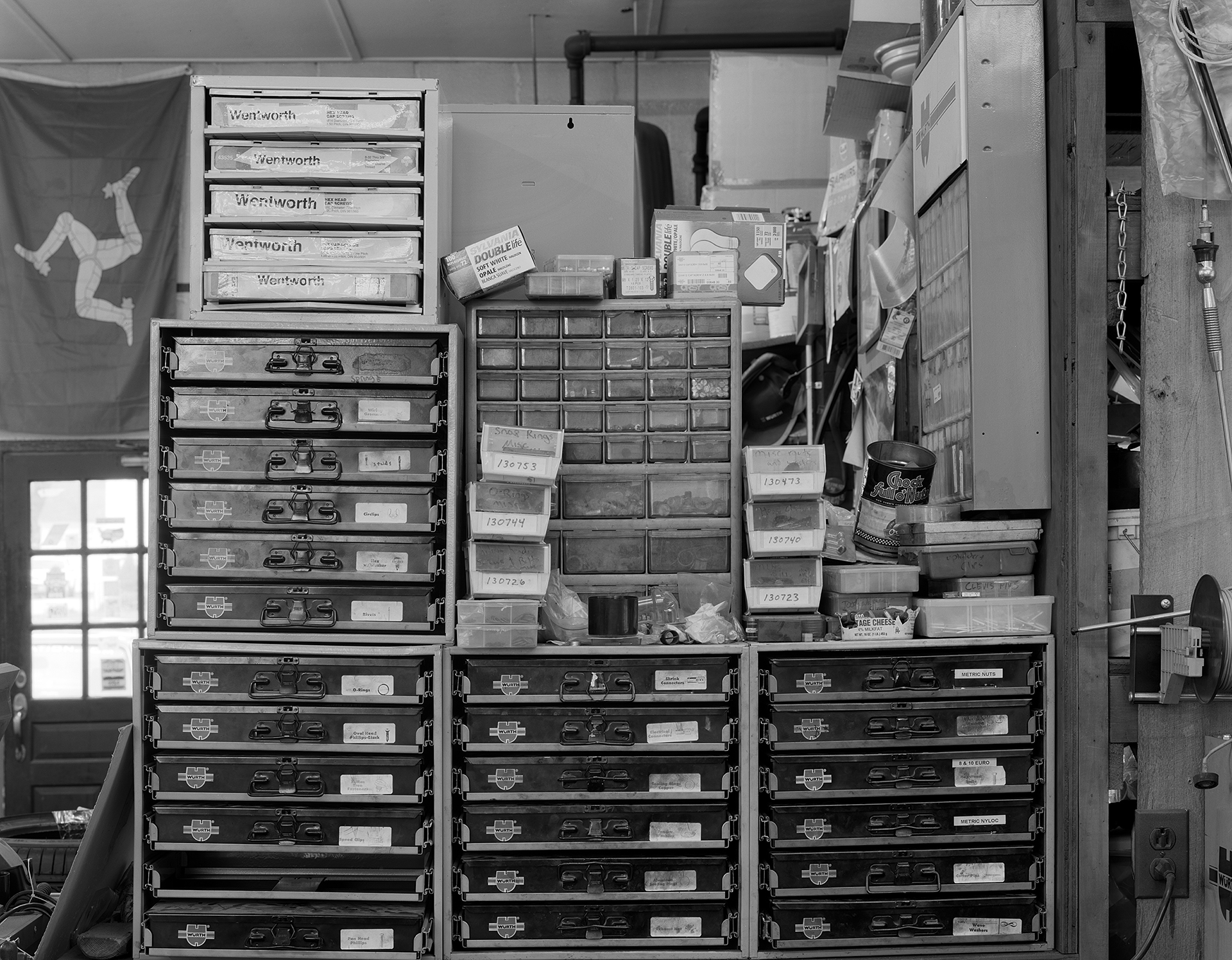 Black & white shot of AVA Restoration services parts boxes