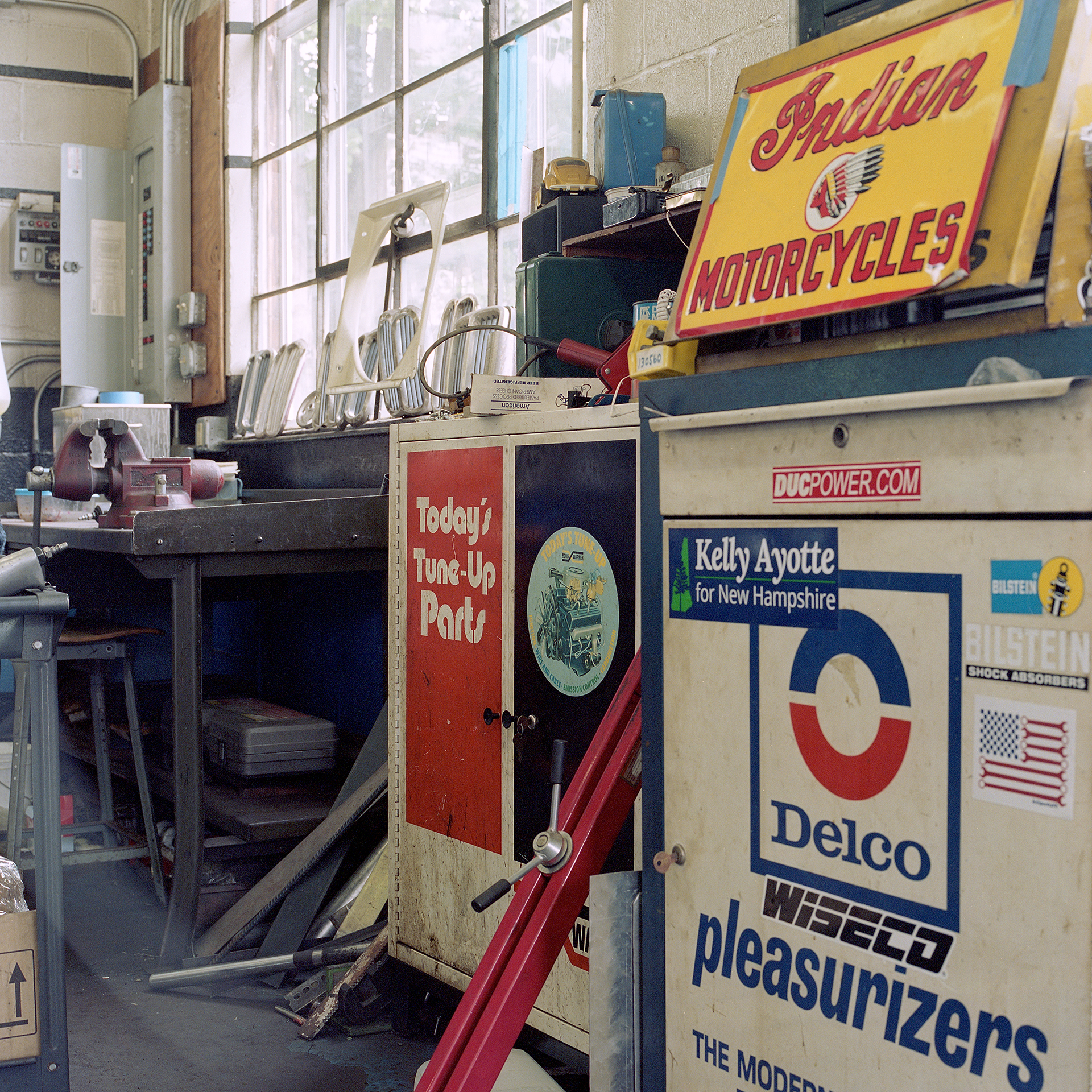 Color photo looking at cabinets and work bench in Ava Restoration